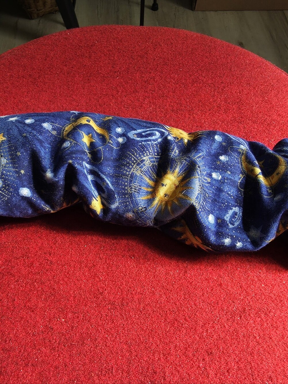 Natures Way, microwavable herbal heating pad featuring a blue celestial sun,moon